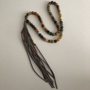 Necklace with gray leather tassel